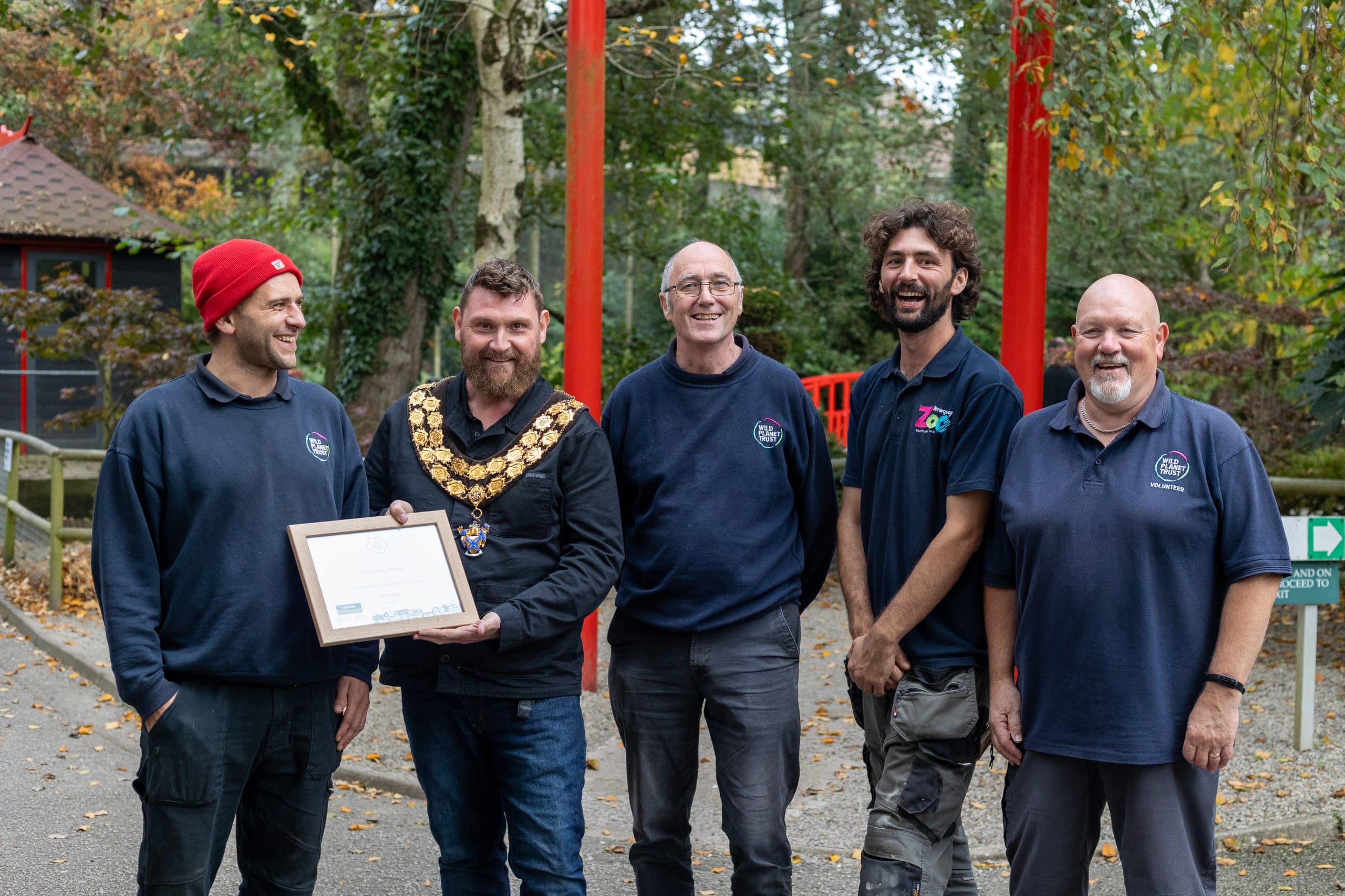 The Newquay Zoo garden team including Head Gardener Damian King, Curator of Plants and Animals John Meek, Gardener Aaron Kinnear, and volunteer gardener Gary Anderson celebrate their Britain in Bloom Gold award with Newquay's Mayor